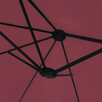 Underside view of a bordeaux double canopy market umbrella showing black metal rib frame and dual hub junction
