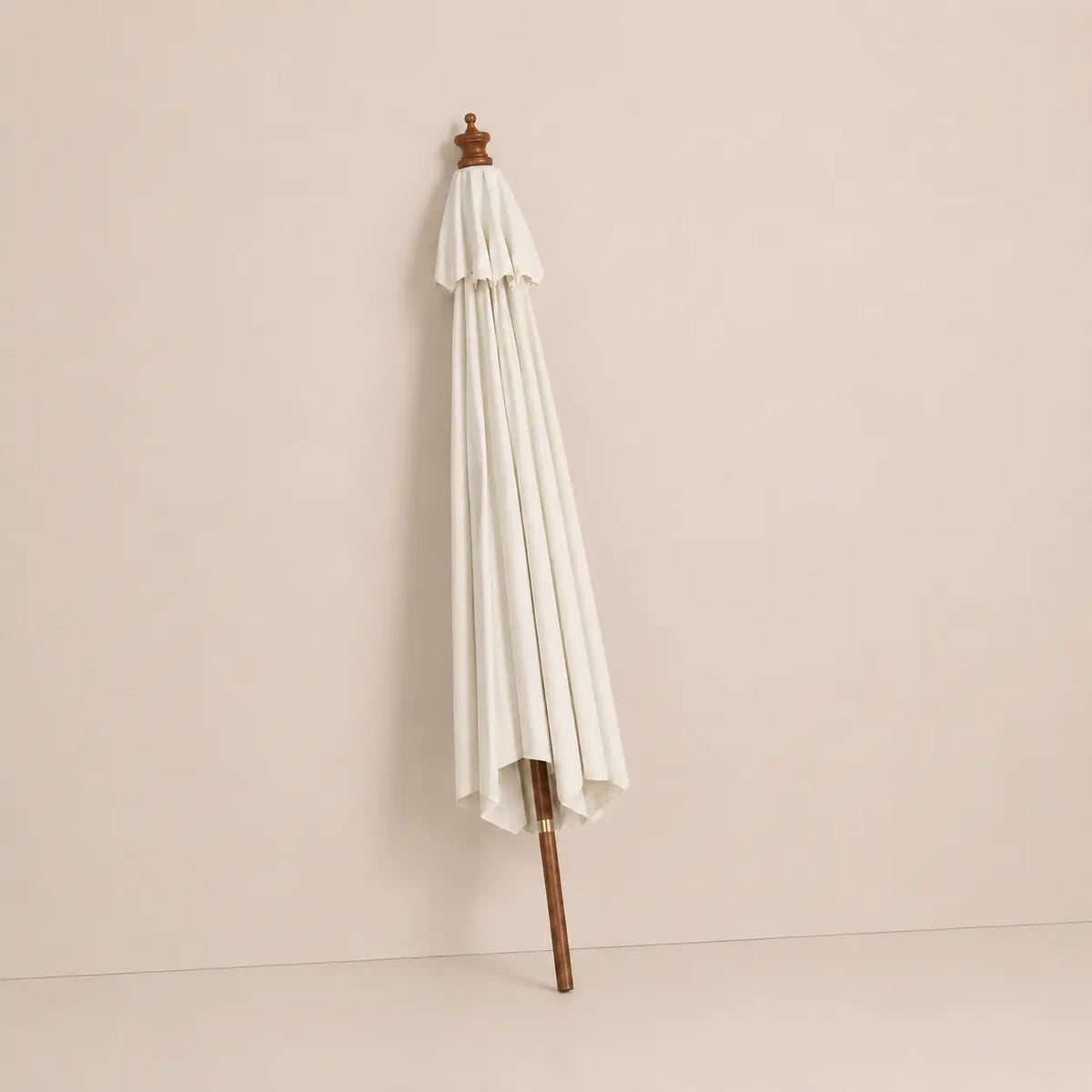 Mas 3m round market umbrella folded closed with sand canopy and turned hardwood finial for compact storage