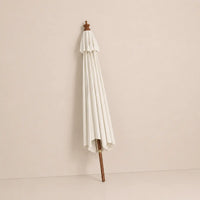 Mas 3m round market umbrella folded closed with sand canopy and turned hardwood finial for compact storage