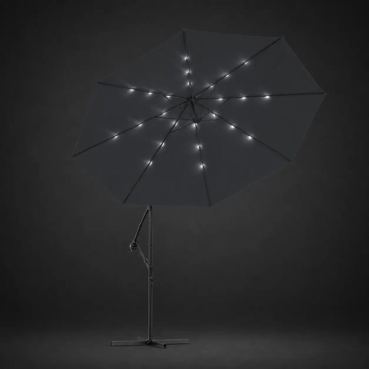 Round cantilever umbrella 3m Black with solar LED lights illuminated along ribs at night – Maestro