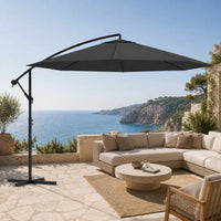 Round cantilever umbrella 3.5m Anthracite shading outdoor sectional sofa on stone coastal terrace – Gregal