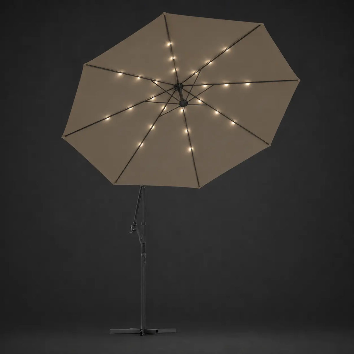 Round cantilever umbrella 3m Taupe with solar LED lights illuminated along ribs at night – Meltem