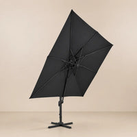 Underside view of the tilted square cantilever umbrella showing the reinforced aluminium rib frame and anthracite canopy