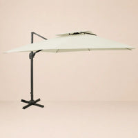 Side profile of the 3x3m ivory cantilever umbrella with double wind-vented canopy and offset aluminium pole