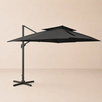 Side profile of the 3x4m black cantilever umbrella with double wind-vented canopy and offset aluminium pole