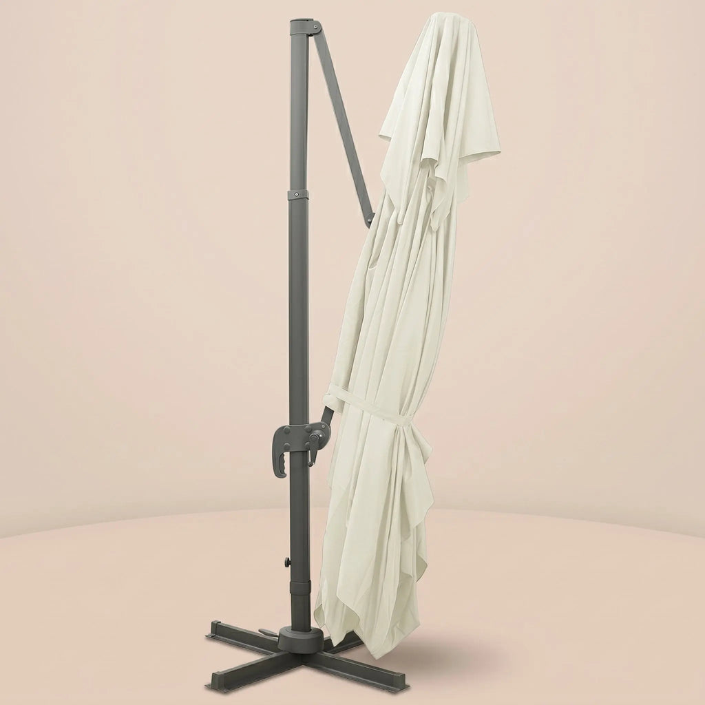 Sirocco XL rectangular cantilever umbrella folded and secured with fabric tie strap for compact storage