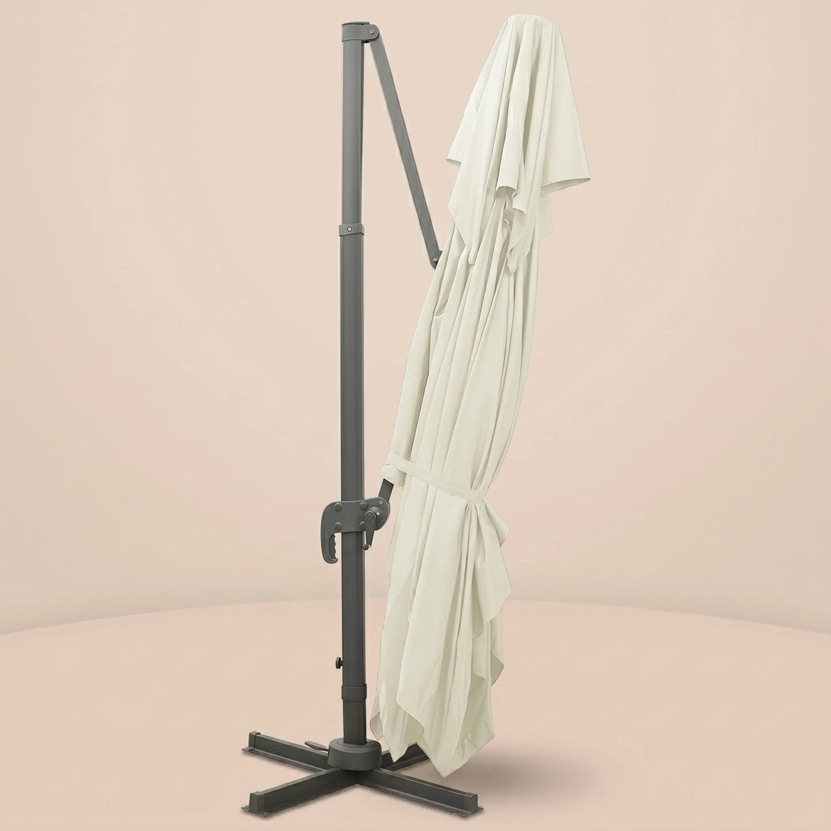 Sirocco XL rectangular cantilever umbrella folded and secured with fabric tie strap for compact storage