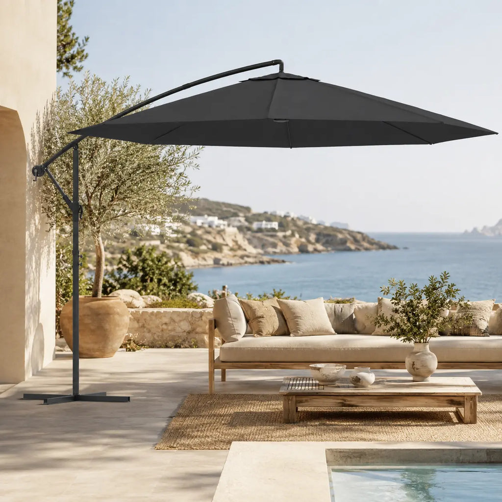 Round cantilever umbrella 3.5m Black over outdoor sofa on villa patio with pool and olive tree – Ostro