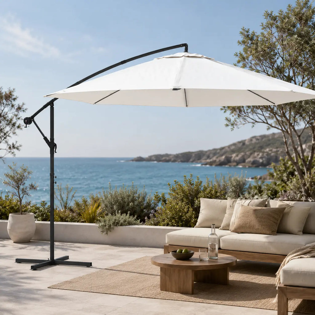 Round cantilever umbrella 3.5m Sand White over outdoor sofa on open sea-view patio with jute rug – Zephyr