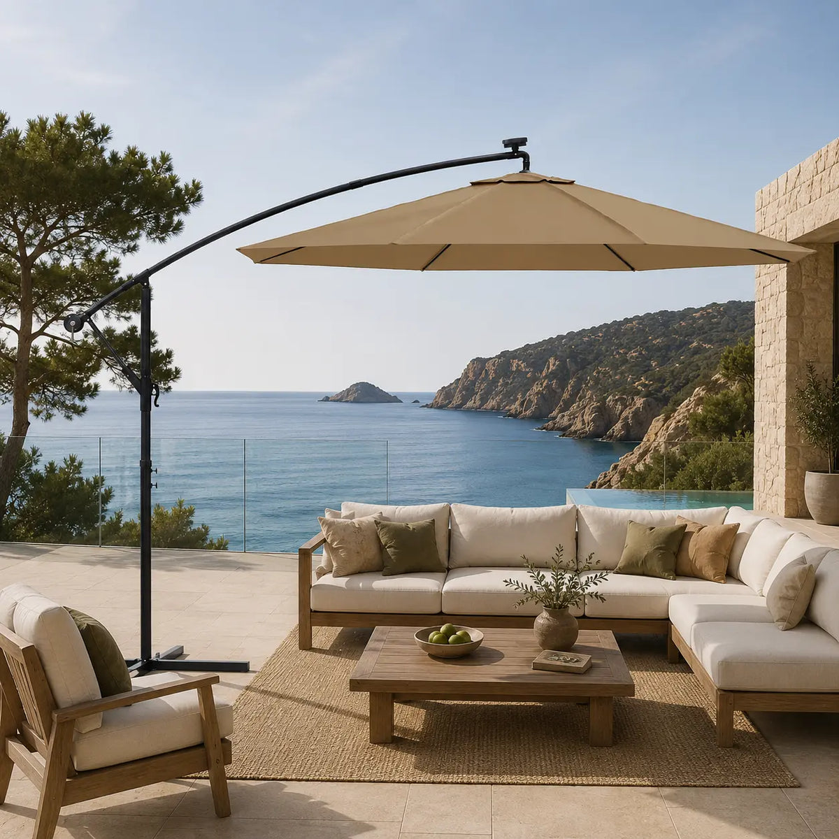 Round cantilever umbrella 3m Taupe shading outdoor teak sectional sofa on coastal terrace with glass railing – Meltem