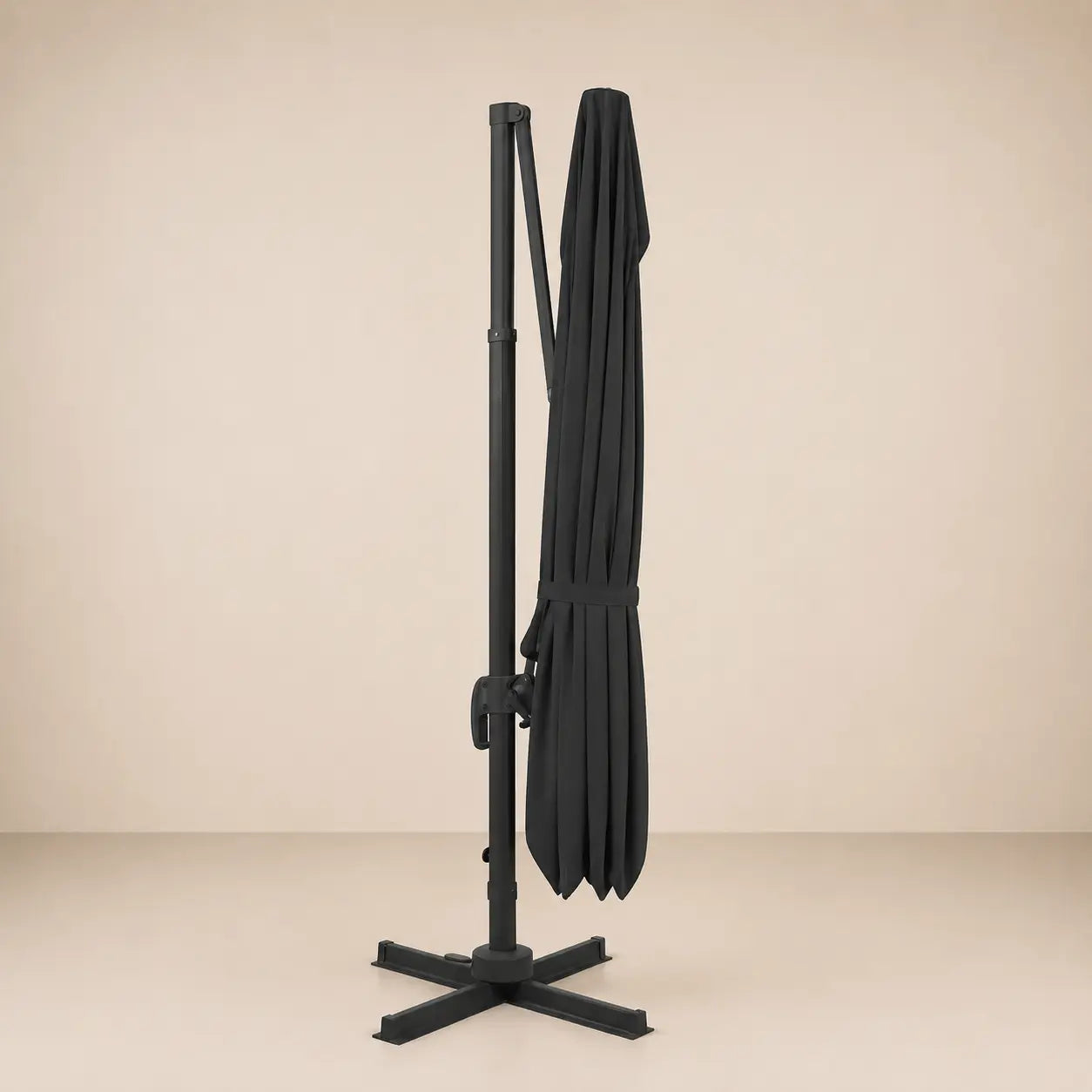 Levant anthracite cantilever umbrella folded and secured with fabric tie strap for compact storage