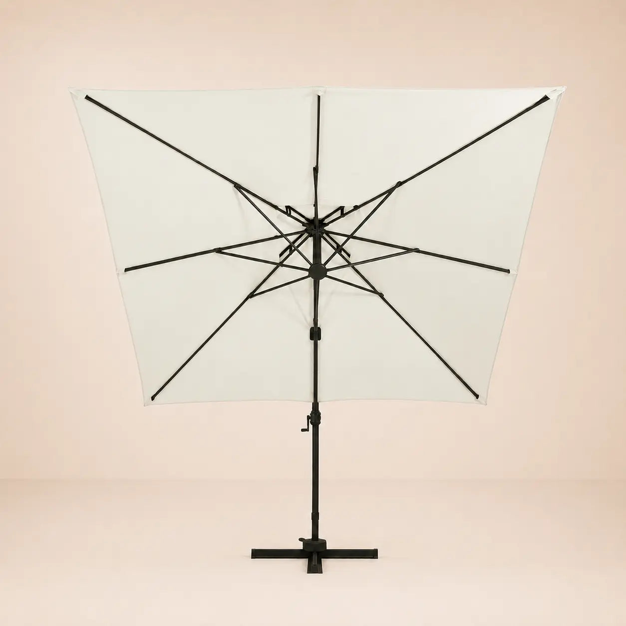 Rear view of the Sirocco square cantilever umbrella with eight-rib frame and vented double canopy in ivory