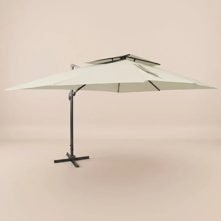 Side profile of the 3x4m ivory cantilever umbrella with double wind-vented canopy and offset aluminium pole
