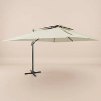 Side profile of the 3x4m ivory cantilever umbrella with double wind-vented canopy and offset aluminium pole
