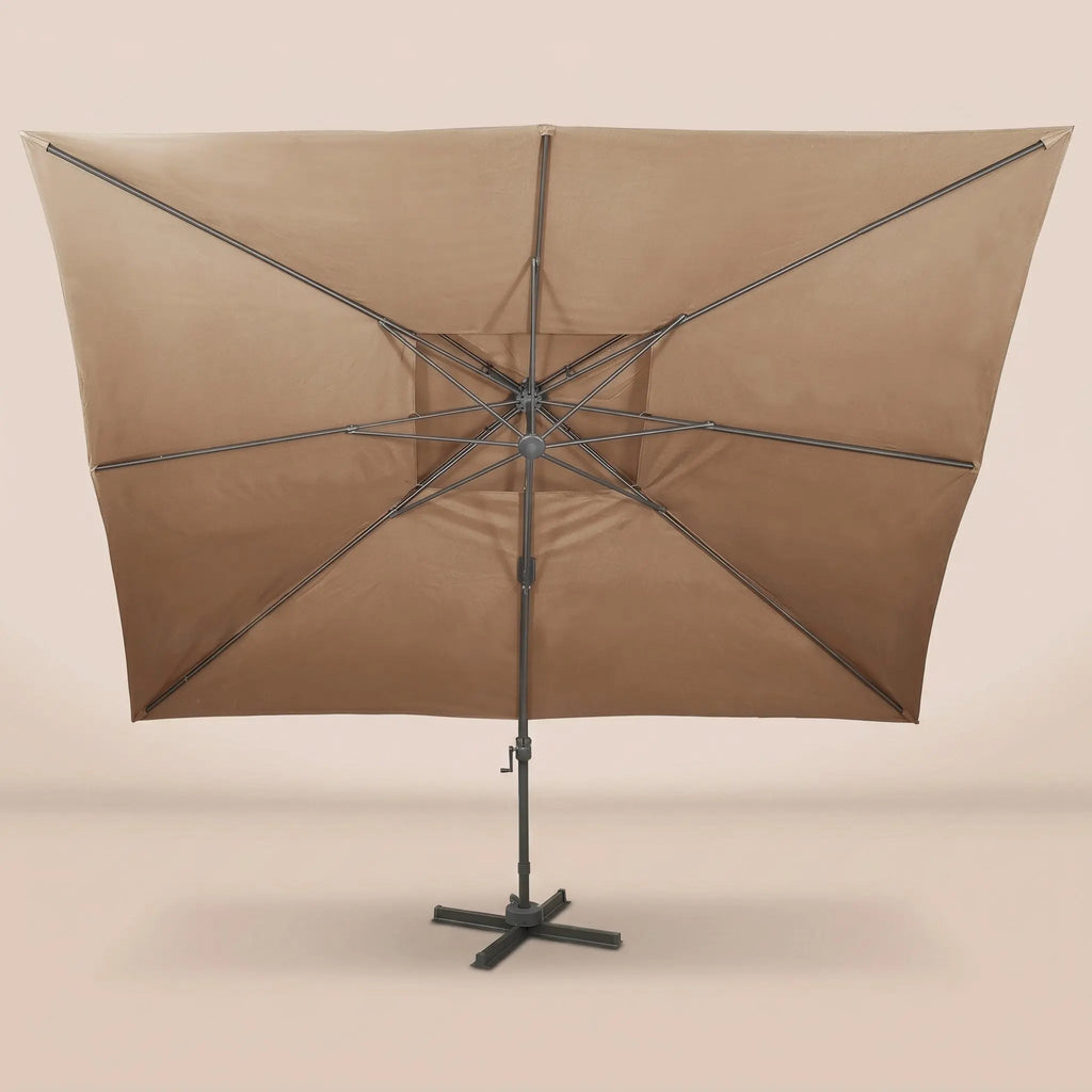 Rear view of the Tramontane XL 3x4m cantilever umbrella with eight-rib frame and vented double canopy in taupe