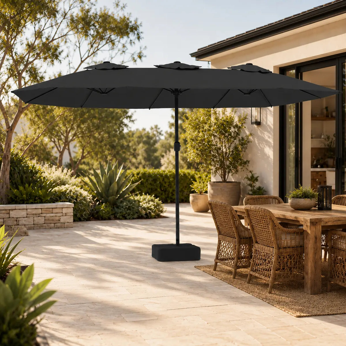 4.5m anthracite double canopy market umbrella shading a wicker outdoor dining table in a garden alfresco setting