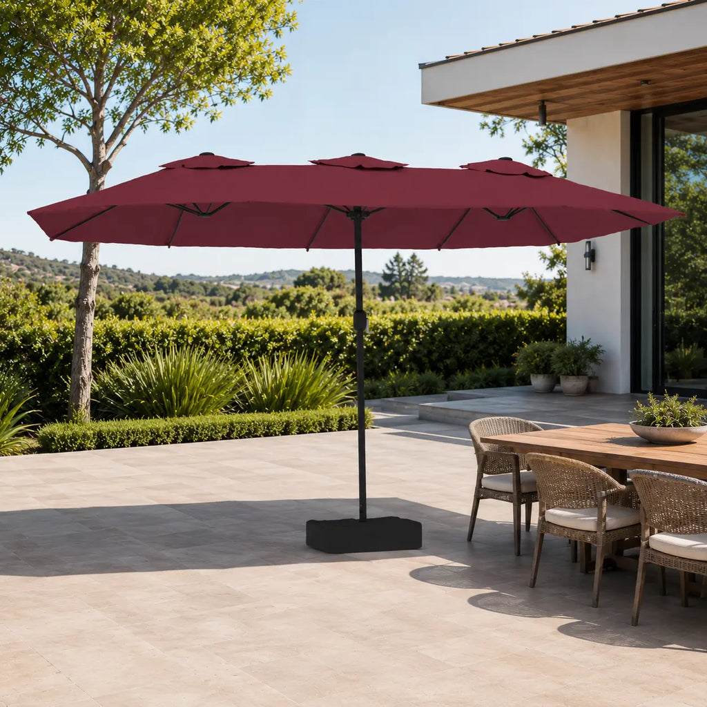 4.5m bordeaux double canopy market umbrella shading a wicker outdoor dining table in a garden alfresco setting