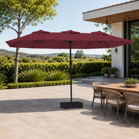 4.5m bordeaux double canopy market umbrella shading a wicker outdoor dining table in a garden alfresco setting