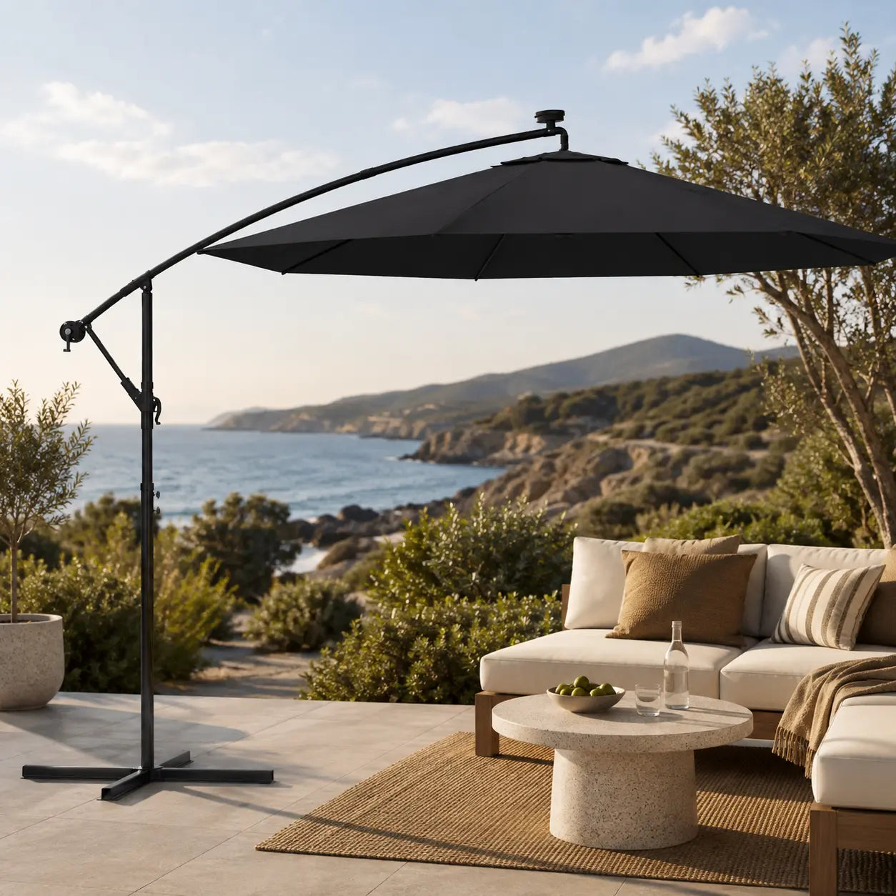 Round cantilever umbrella 3m Black over outdoor lounge set on open sea-view patio with jute rug – Maestro