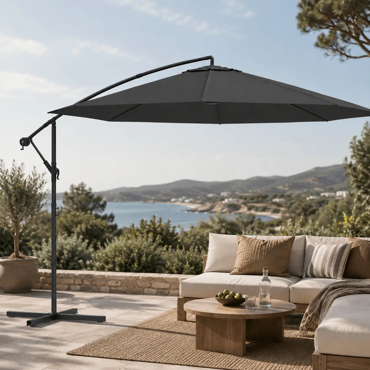 Round cantilever umbrella 3.5m Anthracite over outdoor lounge set on open sea-view patio with jute rug – Gregal