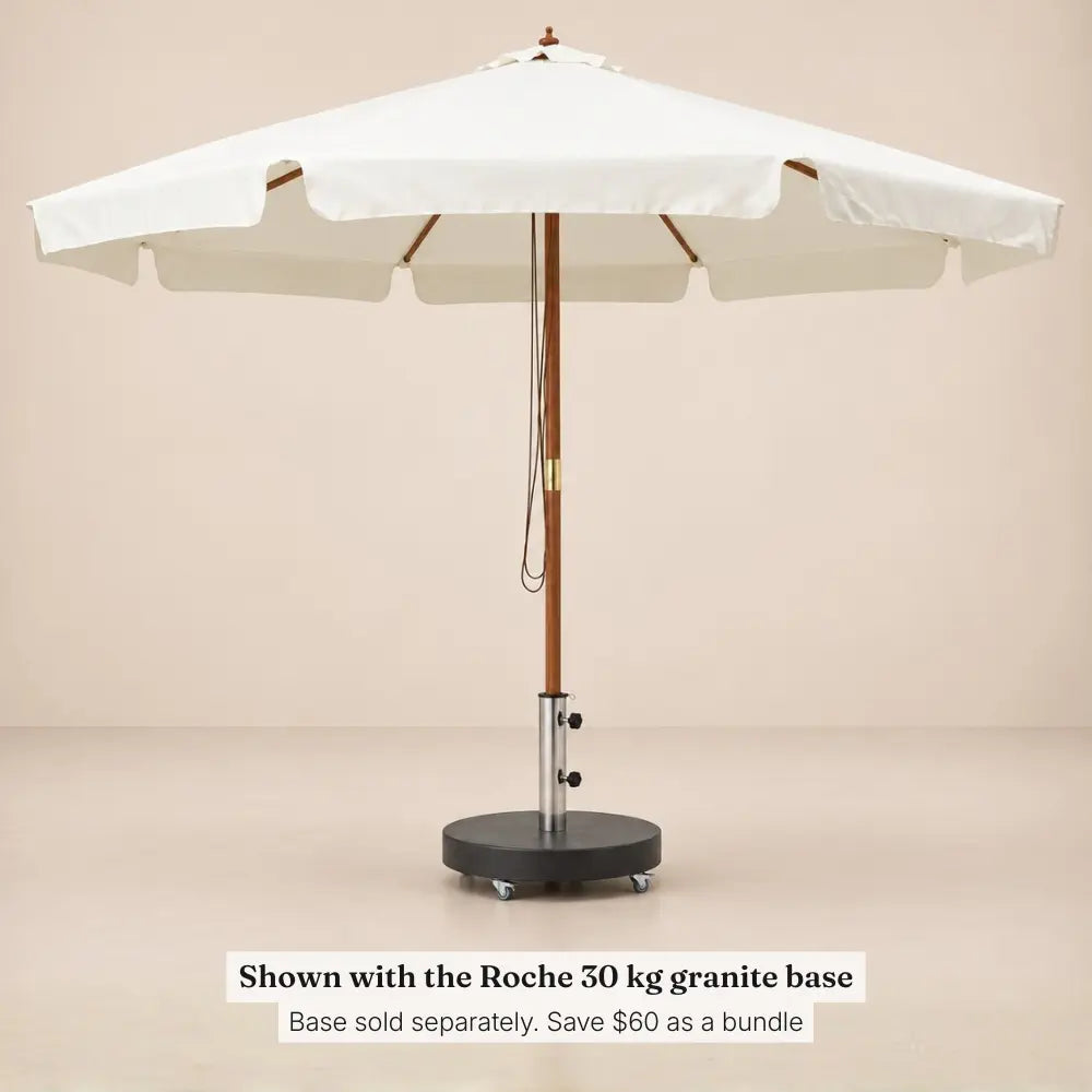 Clos sand white market umbrella standing in the Roche 30 kg granite umbrella base